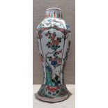 AN 18TH CENTURY CHINESE FAMILLE VERTE PORCELAIN VASE Having a tapering fluted body, the central