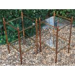 A PAIR OF 20TH CENTURY GILT METAL TWO TIER ÉTAGÈRES With glass shelves and acorn finials.