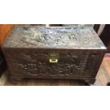 A MID 20TH CENTURY ORIENTAL HEAVILY CARVED CAMPHOR WOOD CHEST. (98cm x 52cm x 48cm)