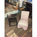 A 19TH CENTURY FRUITWOOD AND OAK COFFIN STOOL Along with a Victorian nursing chair.