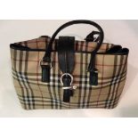 BURBERRY, A CLASSIC CHECK SHOULDER BAG Having black leather handles and strap. (approx w 36cm)