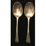 A NEAR PAIR OF GEORGIAN HALLMARKED SILVER TEASPOONS With plain bowl and engraved handle,