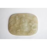 AN 18TH/19TH CENTURY CELADON JADE PLAQUE Carved in relief with a figure seated beneath a pine tree