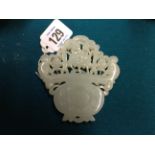 A 19TH CENTURY WHITE JADE PLAQUE Carved and pierced in the form of a flower basket, decorated with a