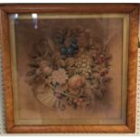 A VICTORIAN NEEDLEWORK PANEL Basket of flowers, birdseye maple framed and glazed. (53cm x 53cm)