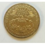 AN EARLY 20TH CENTURY 22CT GOLD AMERICAN $20 COIN Having a portrait of Liberty and the American