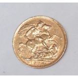 AN EDWARDIAN 22CT GOLD FULL SOVEREIGN  Having a portrait of King Edward VII and George and The