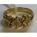 AN EDWARDIAN HALLMARKED 18CT GOLD AND DIAMOND THREE STONE RING The three slightly graduated old