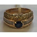 AN 18CT GOLD, SAPPHIRE AND DIAMOND DRESS RING The oval cut sapphire rubover set, to centre of a band