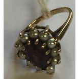 A HALLMARKED 9CT GOLD, AMETHYST AND CULTURED PEARL CLUSTER/DRESS RING The pear cut amethyst claw