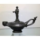 A 19TH CENTURY BRONZE DESK SEAL Modelled as an oil lamp, with figural statue. (16cm x 11cm)