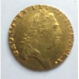 A GEORGIAN 22CT GOLD 1793 SPADE GUINEA COIN Having a portrait of George III and a shield design