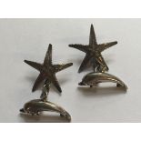 A PAIR OF HALLMARKED SILVER CUFFLINKS Each cufflink comprises a dolphin and a starfish, connected by