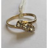 A HALLMARKED 9CT GOLD AND DIAMOND THREE STONE RING The three slightly graduated brilliant cut