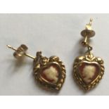 A PAIR OF HALLMARKED 9CT GOLD SHELL CAMEO DROP EARRINGS The heart form cameos depicting the bust