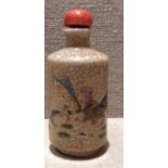 AN ANTIQUE CHINESE POTTERY SNUFF BOTTLE The crackle glazed body hand painted with chickens and