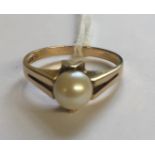A HALLMARKED 9CT GOLD AND CULTURED PEARL DRESS RING The single 6.5mm white cultured pearl, peg set