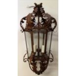 A 20TH CENTURY CAST METAL AND GLASS HALL LANTERN Of hexagonal shape, the frame set with six glass