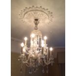 A LATE 19TH/EARLY 20TH CENTURY VENETIAN GLASS CHANDELIER Having ten branches, hung with prism