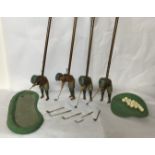 SCHOENHUT, AN INDOOR GOLF GAME Complete with four Tommy Green wooden figural clubs, Bunkers spare