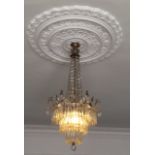 AN EDWARDIAN GLASS CHANDELIER Hung with crystal drops.