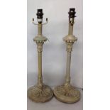 A PAIR OF MODERN WOODEN LAMPS Having a wreathing flute decoration, painted with a crackle glaze