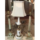 THREE ONYX AND BRASS TABLE LAMPS.