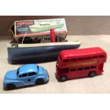 MINIC, A COLLECTION OF VINTAGE TOYS Comprising a tug boat, with a red funnel, grey base and