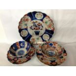A COLLECTION OF THREE 19TH CENTURY AND LATER JAPANESE IMARI CHARGERS Having scalloped edges and hand