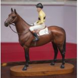 ARKLE, A BESWICK SCULPTURE Of Jockey Pat Taffe. (h 12")