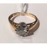 A 22CT GOLD AND DIAMOND SOLITAIRE RING The brilliant cut diamond illusion set in white metal, the