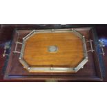 AN EDWARDIAN OAK TWO HANDLED SERVING TRAY WITH SILVER PLATED GALLERY Along with another.