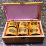 A MAUCHLINWARE CASED SET OF SIX NAPKIN RINGS Pictured with various historic buildings.