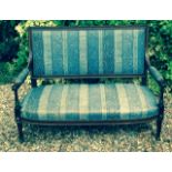 A GOOD 19TH CENTURY FRENCH MAHOGANY AND BRASS BANDED TWO SEATER SETTEE With upholstered seat and