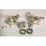 A PAIR OF EARLY 20TH CENTURY HALLMARKED SILVER GRAVY BOATS Birmingham 1930, together with a silver