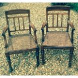 A PAIR OF ANGLO ROSEWOOD OPEN ARMCHAIRS WITH CANED SEATS On ring turned legs, recently repolished