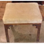 A 19TH CENTURY MAHOGANY FOOT STOOL With Chippendale blind fret legs. (48cm x 43cm x 55cm)