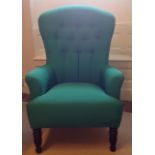 A PARKER KNOLL CHAIR With later green silk button back upholstery, raised on ebonised legs. (h 107cm