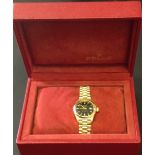 ROLEX, OYSTER PERPETUAL, AN 18CT GOLD LADIES' WRISTWATCH With black face, bar markers, seconds