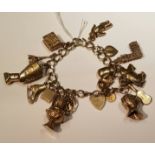 A HALLMARKED 9CT GOLD FLAT CURB LINK CHARM BRACELET Having a heart form padlock clasp and safety