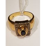 AN 18CT GOLD, SAPPHIRE AND DIAMOND DRESS RING The oval cut sapphire in a high collet setting, to