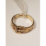 A HALLMARKED 9CT GOLD AND DIAMOND BUCKLE RING The flat section ring with scrolling decoration and