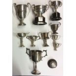 A COLLECTION OF NINE VINTAGE HALLMARKED SILVER MINIATURE PRESENTATION TROPHIES To include The Bath