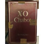 X.O. CHABOT ARMAGNAC, A LIMITED EDITION LIMOGES PORCELAIN BOTTLE OF ARMAGNAC With gilt decoration,