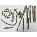 A COLLECTION OF VARIOUS WHITE METAL ITEMS To include babies rattles, Albert chain, propelling