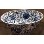 A LARGE CHINESE BLUE AND WHITE PORCELAIN BOWL Decorated with stylized flowers, bearing a six