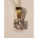 AN 18CT GOLD AND DIAMOND SINGLE STONE PENDANT The brilliant cut diamond claw set in white gold, to a