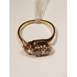 AN EARLY 20TH CENTURY 18CT GOLD AND DIAMOND THREE STONE RING The three graduating old cut diamonds