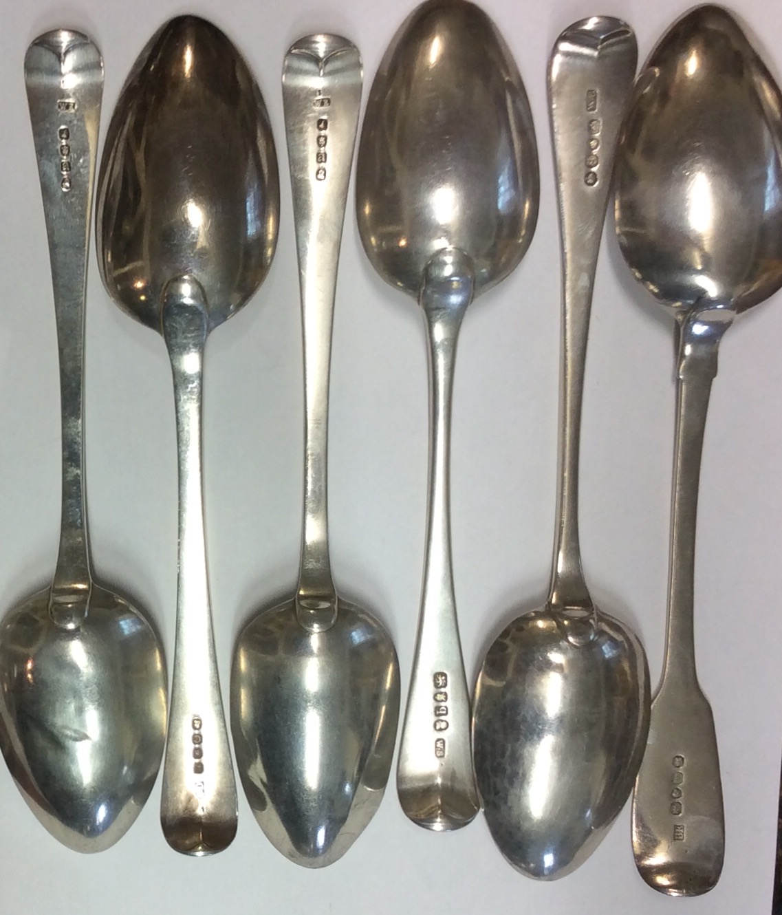 A COLLECTION OF SIX GEORGIAN SILVER TABLESPOONS London hallmarks W.E. 1776, W.S. 1791, W.C. 1827.