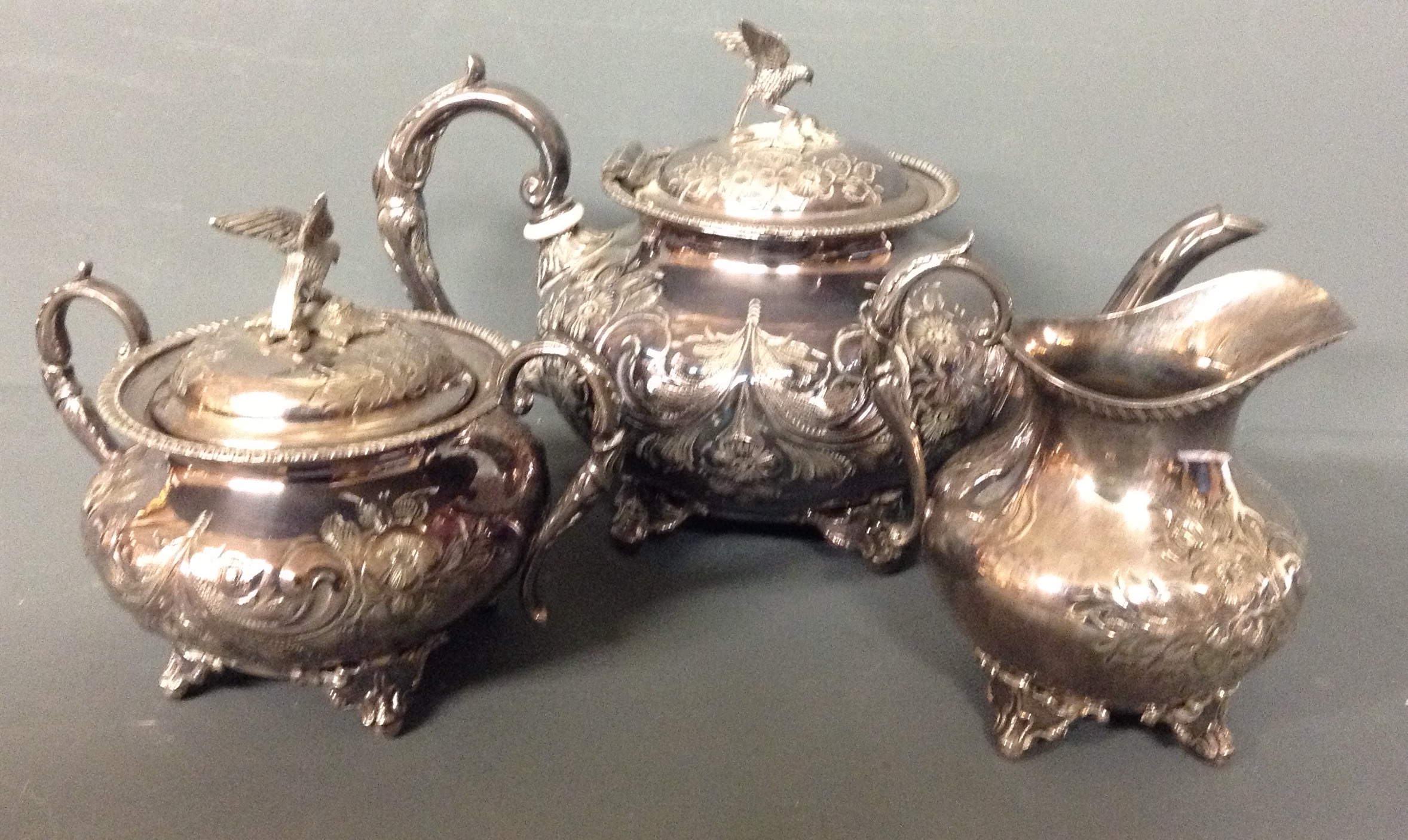 E.P.B.M., AN EARLY 20TH CENTURY THREE PIECE SILVER PLATED TEA SERVICE Comprising a teapot, sugar